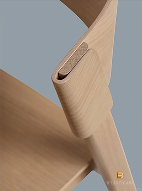 Detail of custom light wood furniture joint, exemplifying precise joinery craftsmanship.